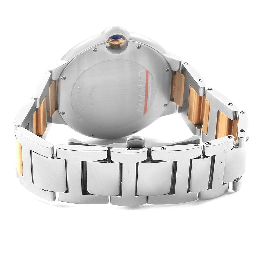 The image shows the back and bracelet of a Ballon Bleu model by Cartier, highlighting the clasp and metal links.