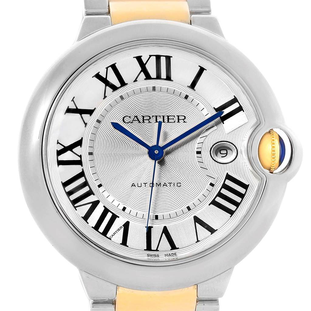 The image shows a close-up of the Ballon Bleu by Cartier watch, highlighting its face, Roman numerals, and blue hands.