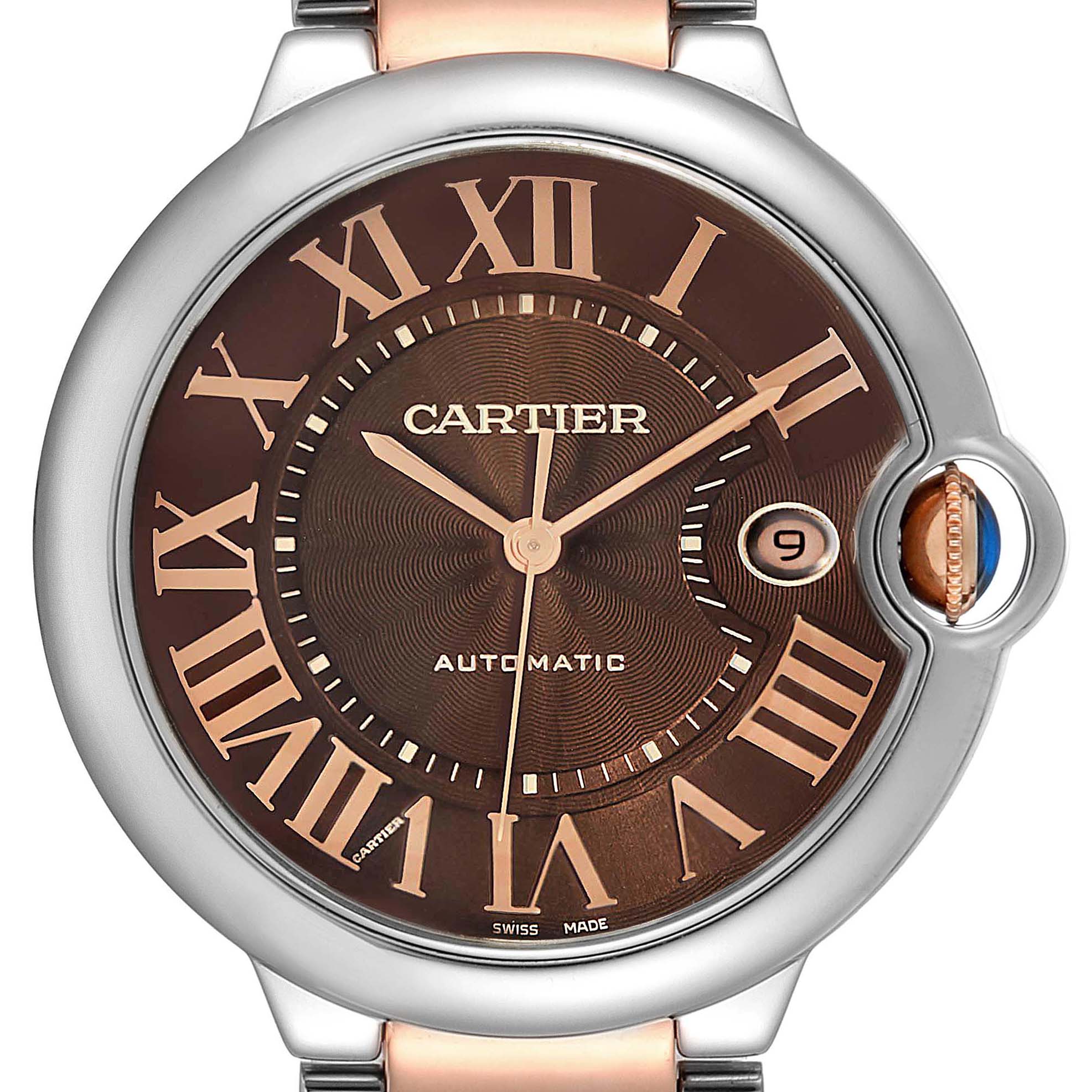 The image shows a front view of a Cartier Ballon Bleu W6920032 Men's Steel and Gold (two tone) Brown Dial W6920032 Men's Steel and Gold (two tone) Brown Dial watch, highlighting its dial and crown with Roman numerals.