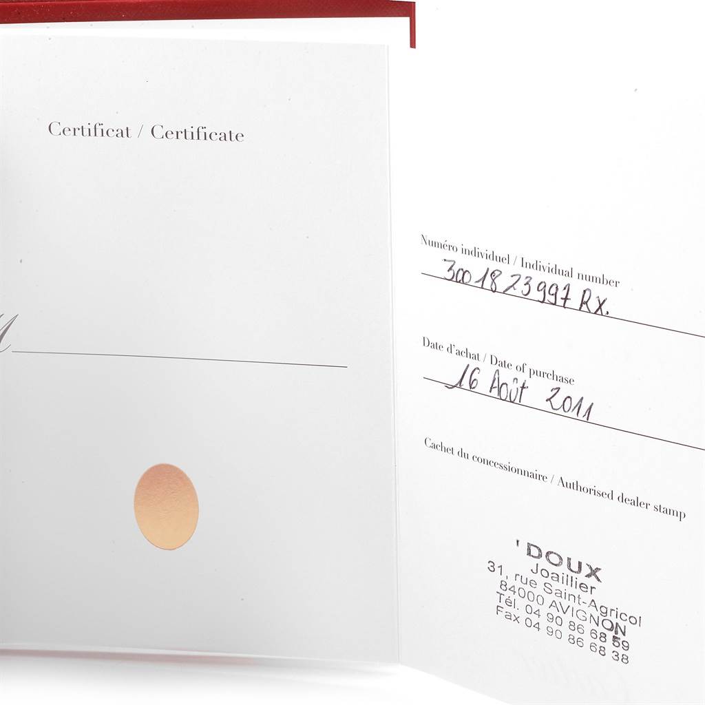 The image shows an open certificate with the individual number and date of purchase for the Ballon Bleu de Cartier watch.