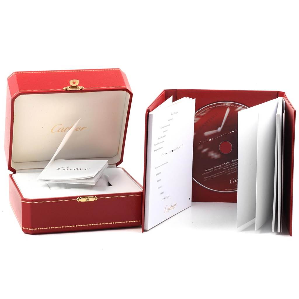 The image shows the packaging and accessories of a Cartier Ballon Bleu W69012Z4 Men's Stainless Steel Silver Dial W69012Z4 Men's Stainless Steel Silver Dial watch, including a red box, booklet, and CD.