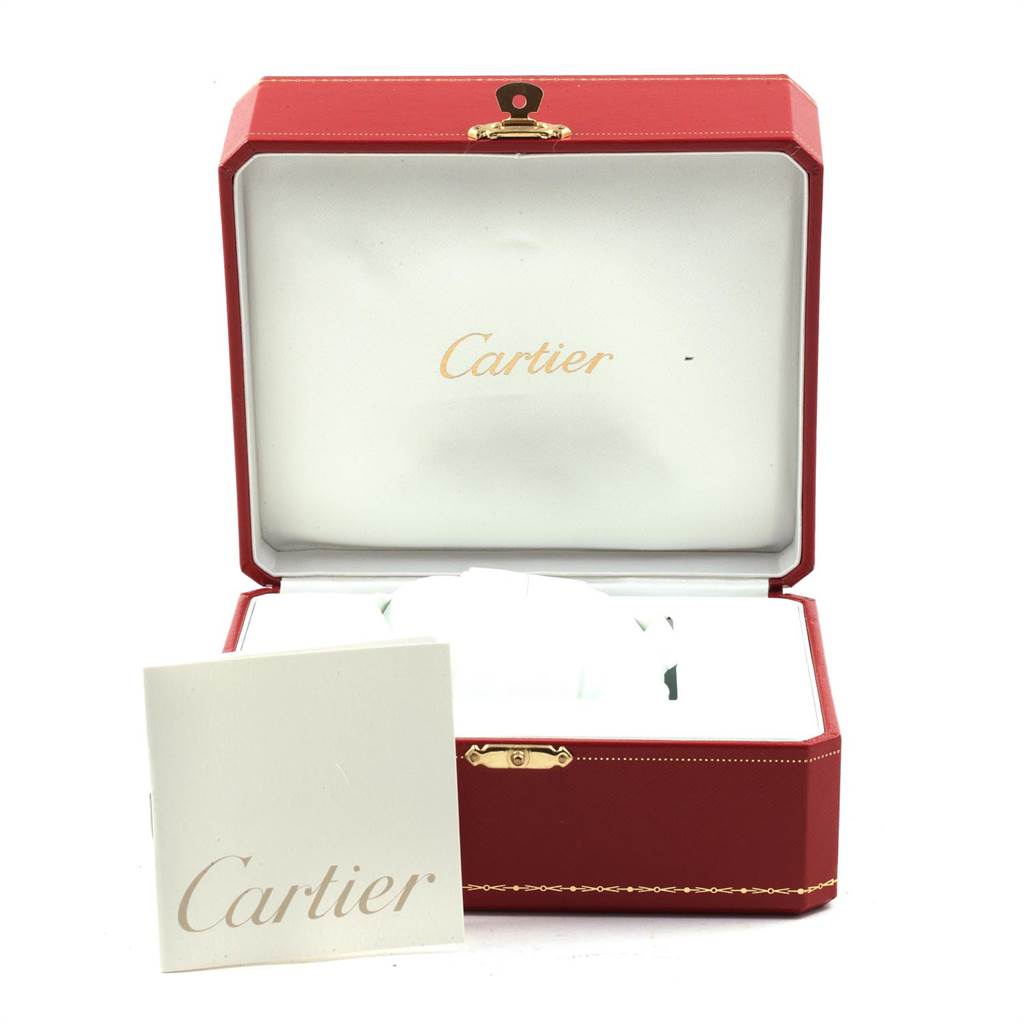 The image shows an open red Cartier box with the Ballon Bleu model inside and a Cartier manual in front.