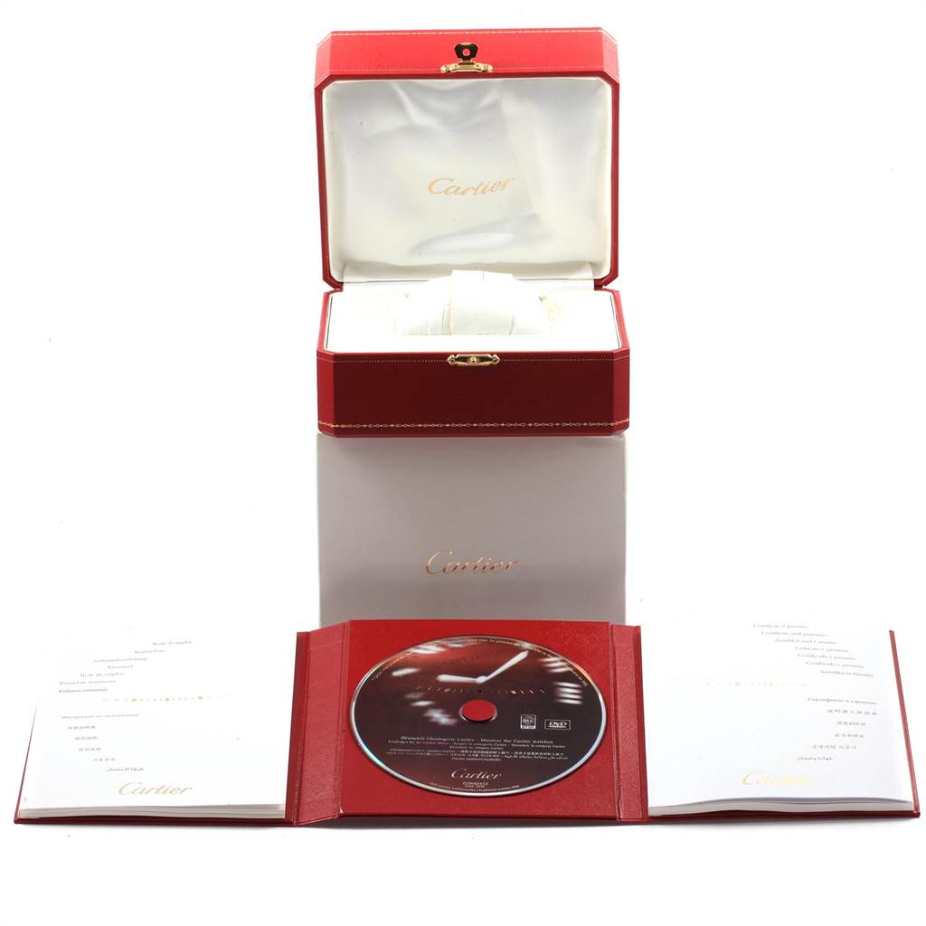 The image shows the packaging and accessories of a Cartier Ballon Bleu W69012Z4 Men's Stainless Steel Silver Dial W69012Z4 Men's Stainless Steel Silver Dial model, including the box, manual, and a CD.