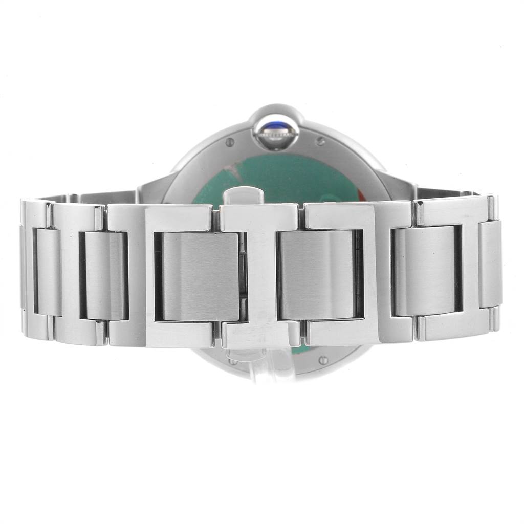 The image shows the back and bracelet of a Ballon Bleu watch by Cartier, highlighting the stainless steel links.