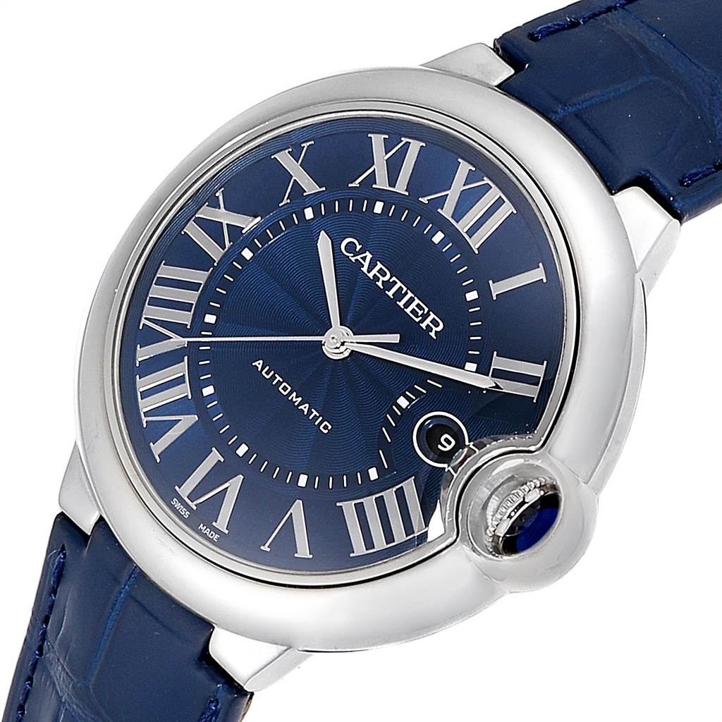 The image shows a close-up view of a Cartier Ballon Bleu WSBB0025 Men
s Stainless Steel Blue Dial WSBB0025 Men
s Stainless Steel Blue Dial watch, highlighting the blue dial, Roman numerals, and silver casing.