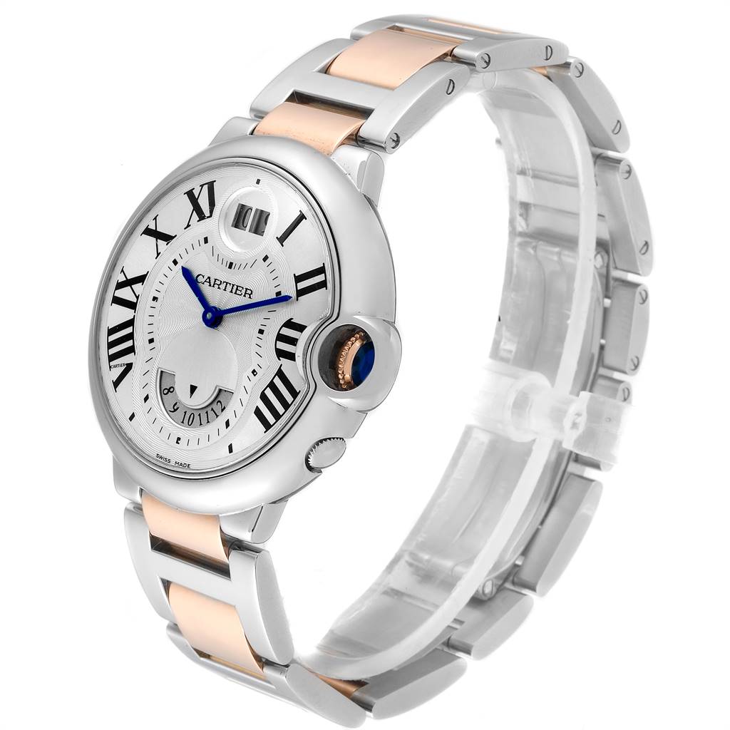 The image shows a Cartier Ballon Bleu W6920027 Men's Steel and Gold (two tone) Silver Dial W6920027 Men's Steel and Gold (two tone) Silver Dial watch at a three-quarter angle, highlighting its dial, crown, and two-tone bracelet.