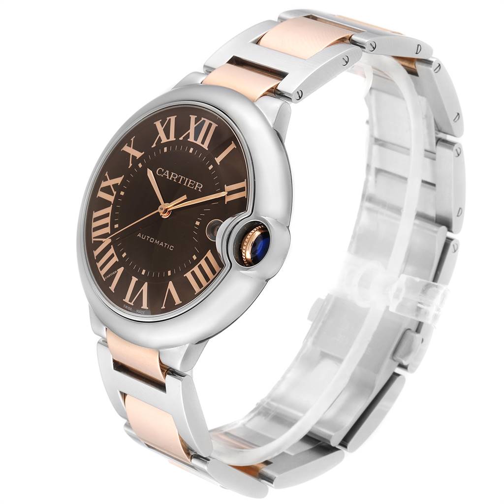 The image shows a Cartier Ballon Bleu W6920032 Men's Steel and Gold (two tone) Brown Dial W6920032 Men's Steel and Gold (two tone) Brown Dial watch at a three-quarter angle, highlighting its face, dial, crown, and part of the bracelet.