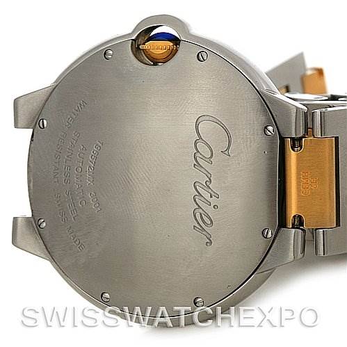 This image shows the case back of a Ballon Bleu model by Cartier, highlighting the brand's logo and part of the metal bracelet.