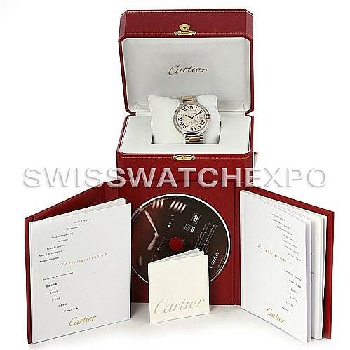 The image shows a Cartier Ballon Bleu W69009Z3 Men
s Stainless Steel Silver Dial W69009Z3 Men
s Stainless Steel Silver Dial watch in its open box, accompanied by documentation and a CD.