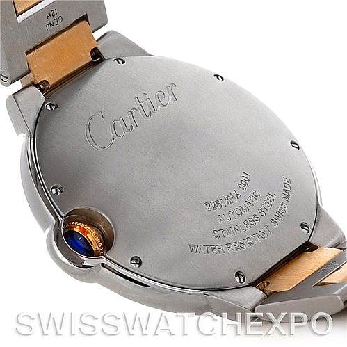The image shows the back case of a Cartier Ballon Bleu W69009Z3 Men's Stainless Steel Silver Dial W69009Z3 Men's Stainless Steel Silver Dial watch, highlighting the brand engraving and crown.