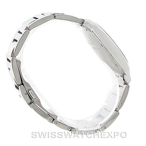 The image shows a side view of the Ballon Bleu model by Cartier, highlighting the watch
s profile and bracelet links.