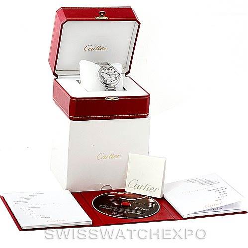 The image shows a Cartier Ballon Bleu W69012Z4 Men
s Stainless Steel Silver Dial W69012Z4 Men
s Stainless Steel Silver Dial watch in its box, with accompanying documents and a CD, displayed at an angled view.
