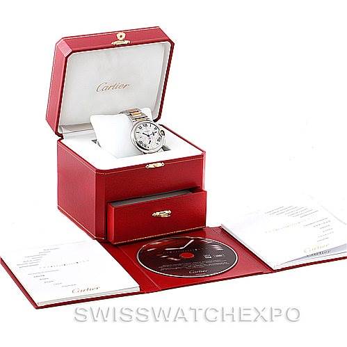 The image shows a Cartier Ballon Bleu W6920063 Men's Steel and Gold (two tone) Silver Dial W6920063 Men's Steel and Gold (two tone) Silver Dial watch in its open box, with included documentation and a DVD.