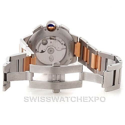 The image shows the back view of a Cartier Ballon Bleu W6920063 Men's Steel and Gold (two tone) Silver Dial W6920063 Men's Steel and Gold (two tone) Silver Dial watch, highlighting the automatic movement and the open clasp mechanism.