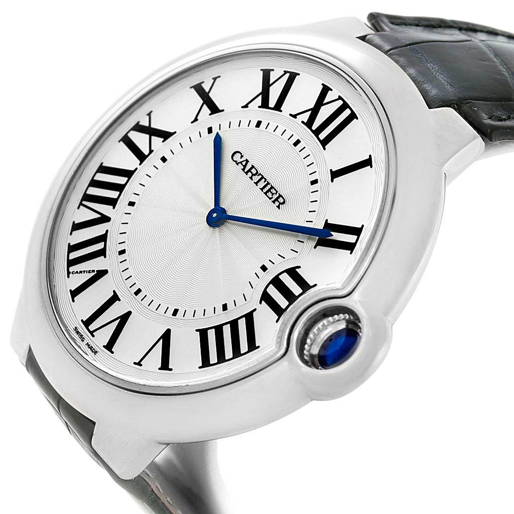 The image shows a close-up, angled view of the dial and part of the strap and crown of a Cartier Ballon Bleu W6920055 Men's White Gold Silver Dial W6920055 Men's White Gold Silver Dial watch.