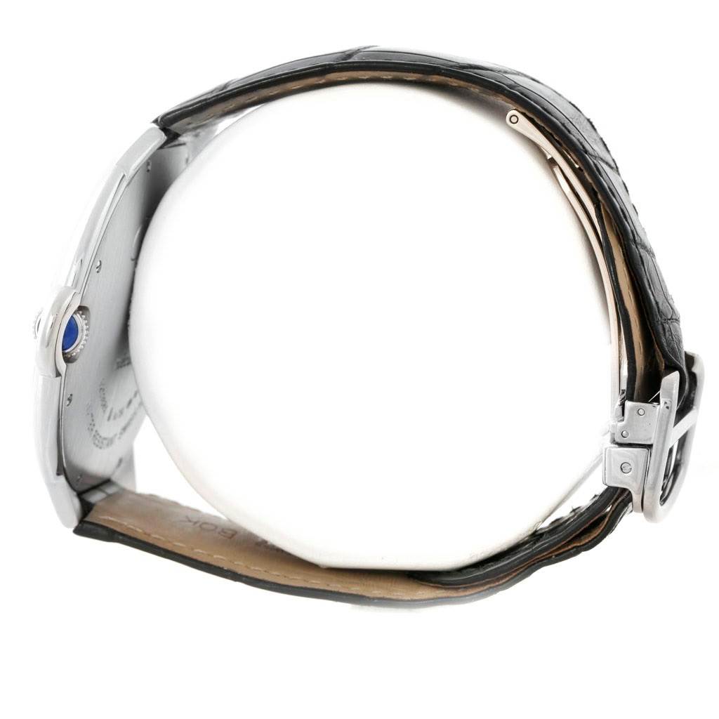 The image shows a side view of a Ballon Bleu model by Cartier, highlighting the leather strap and crown.