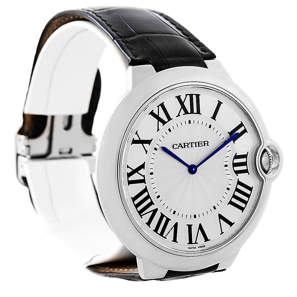 The image shows a Cartier Ballon Bleu W6920055 Men's White Gold Silver Dial W6920055 Men's White Gold Silver Dial watch with a view of its face, Roman numeral markers, and partially the leather strap and clasp.