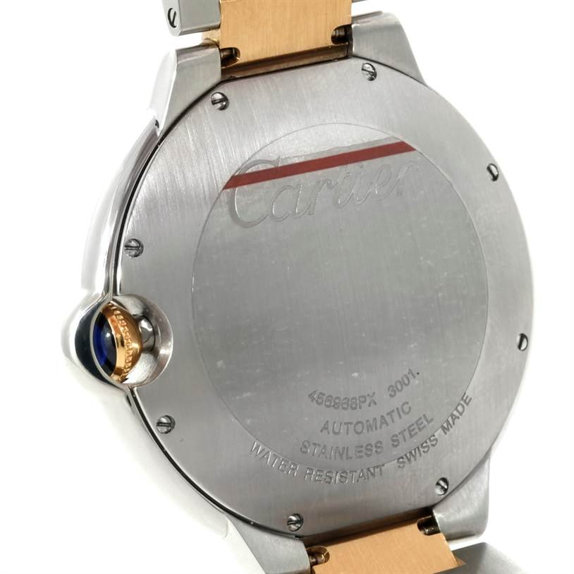 The image shows the back case of the Cartier Ballon Bleu W69009Z3 Men
s Stainless Steel Silver Dial W69009Z3 Men
s Stainless Steel Silver Dial watch, highlighting the crown and case engravings.