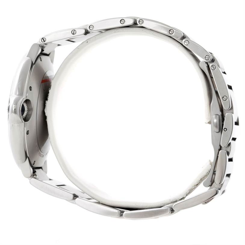 This image shows a side view of the Ballon Bleu watch by Cartier, highlighting its case and metal bracelet.