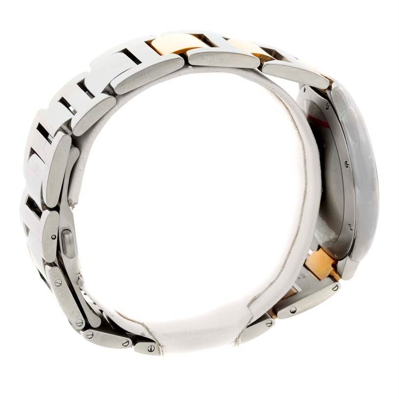 The Ballon Bleu by Cartier watch is shown in a side view, highlighting its bracelet and partially visible case.