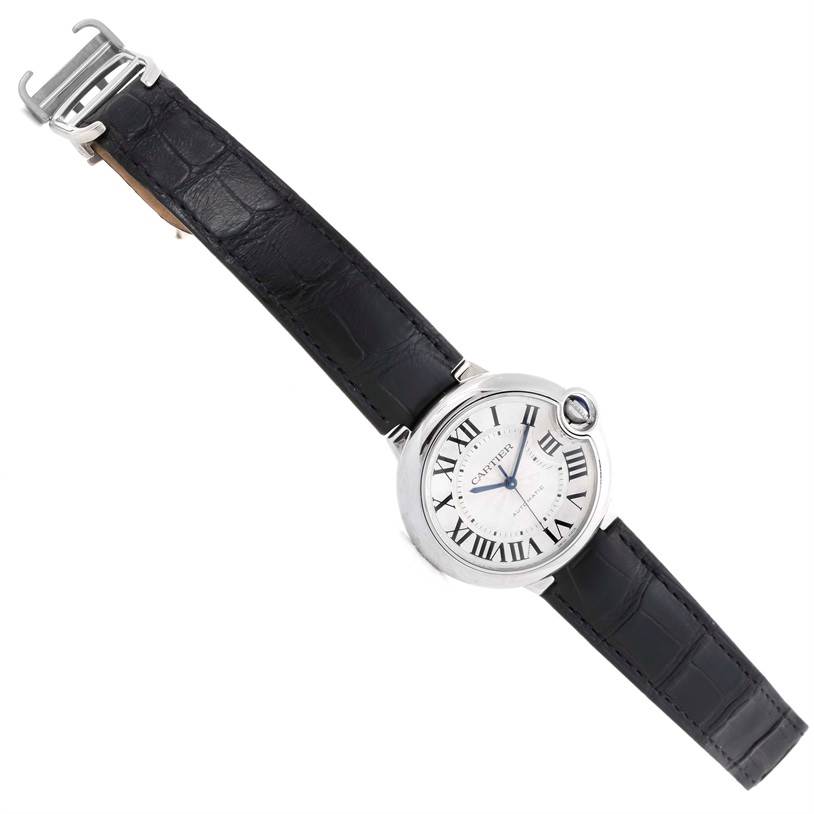 The image shows a top view of a Cartier Ballon Bleu W69017Z4 Women
s Stainless Steel Silver Dial W69017Z4 Women
s Stainless Steel Silver Dial watch with a black leather strap.