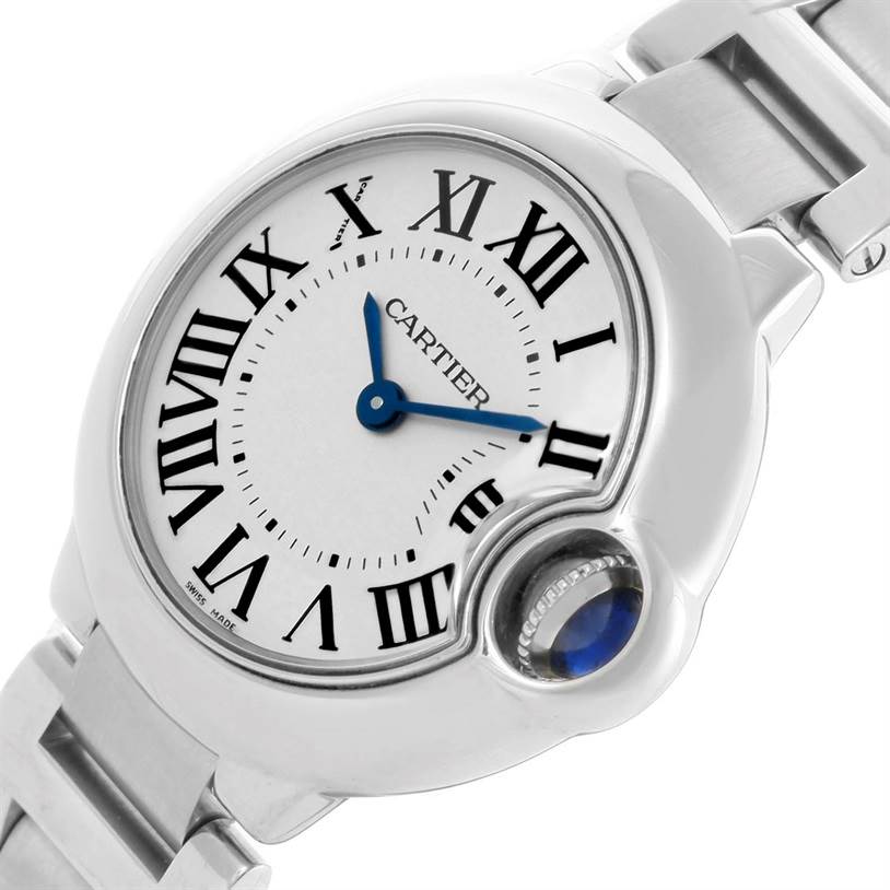 The image shows a close-up of the face and part of the bracelet of the Ballon Bleu model by Cartier at a slight angle.