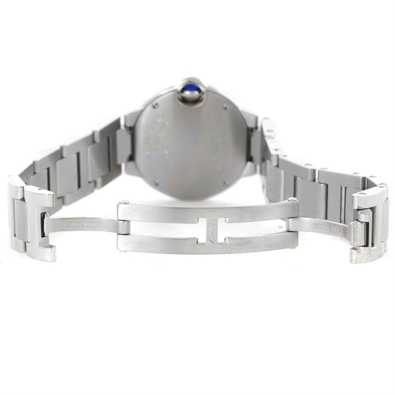 The image shows the open clasp and backside of a Ballon Bleu model watch by Cartier, highlighting the bracelet and case.