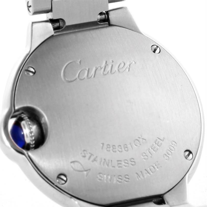 The image shows the back case of the Cartier Ballon Bleu W69010Z4 Women
s Stainless Steel Silver Dial W69010Z4 Women
s Stainless Steel Silver Dial watch, displaying engraved details and the crown.