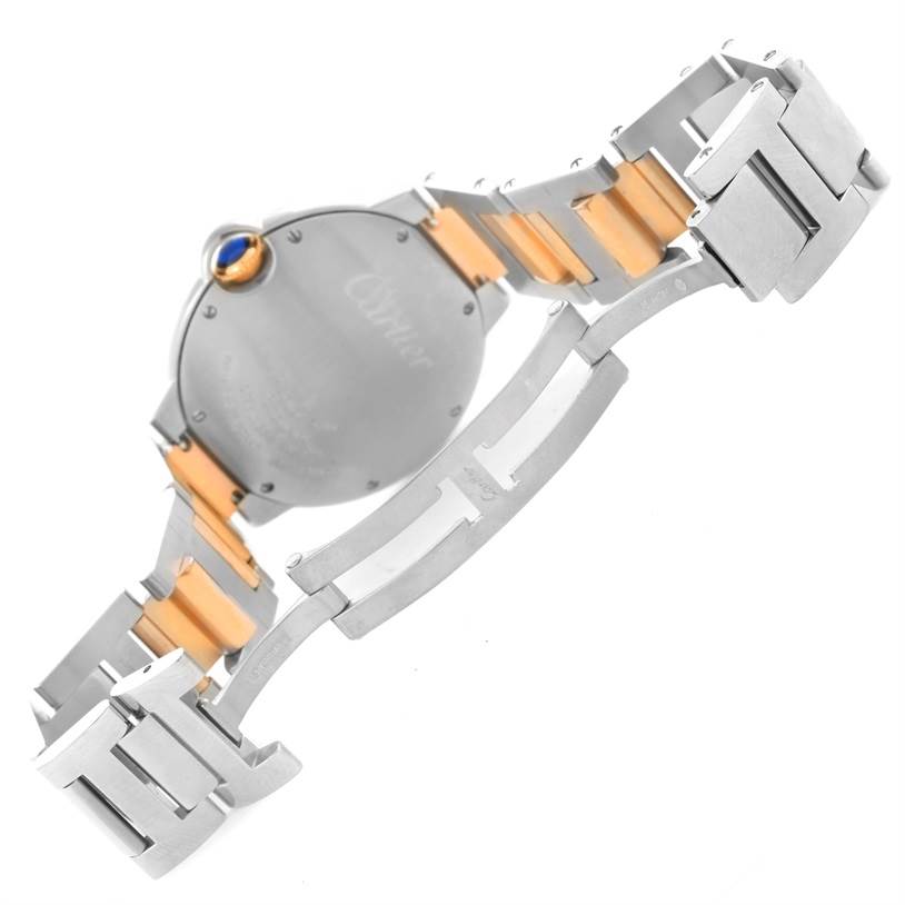 The image shows the back and part of the bracelet of a Ballon Bleu model by Cartier.