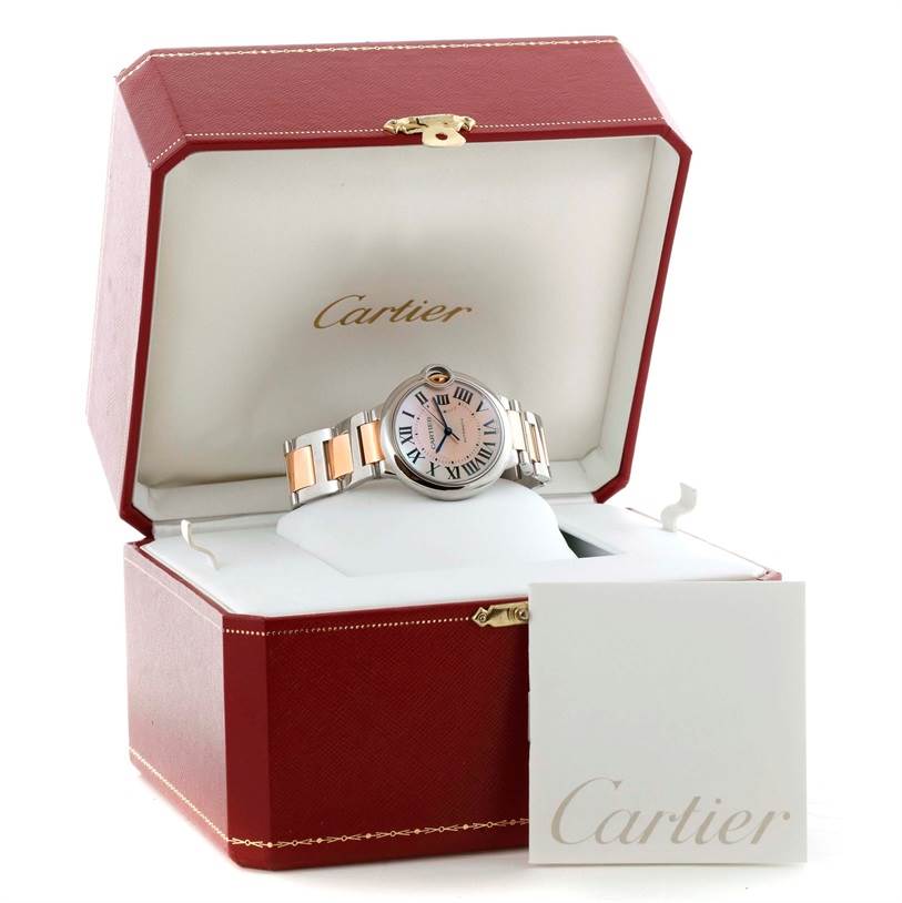 The Cartier Ballon Bleu W6920070 Women's Steel and Gold (two tone) Mother of Pearl Dial W6920070 Women's Steel and Gold (two tone) Mother of Pearl Dial watch is displayed front-facing in an open red Cartier box, showing its face and wristband.