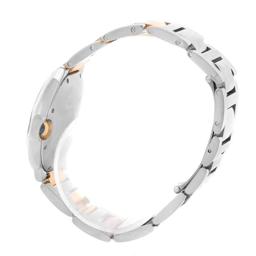 This image shows a side profile view of a Cartier Ballon Bleu W6920070 Women's Steel and Gold (two tone) Mother of Pearl Dial W6920070 Women's Steel and Gold (two tone) Mother of Pearl Dial watch, highlighting its case, crown, and bracelet.