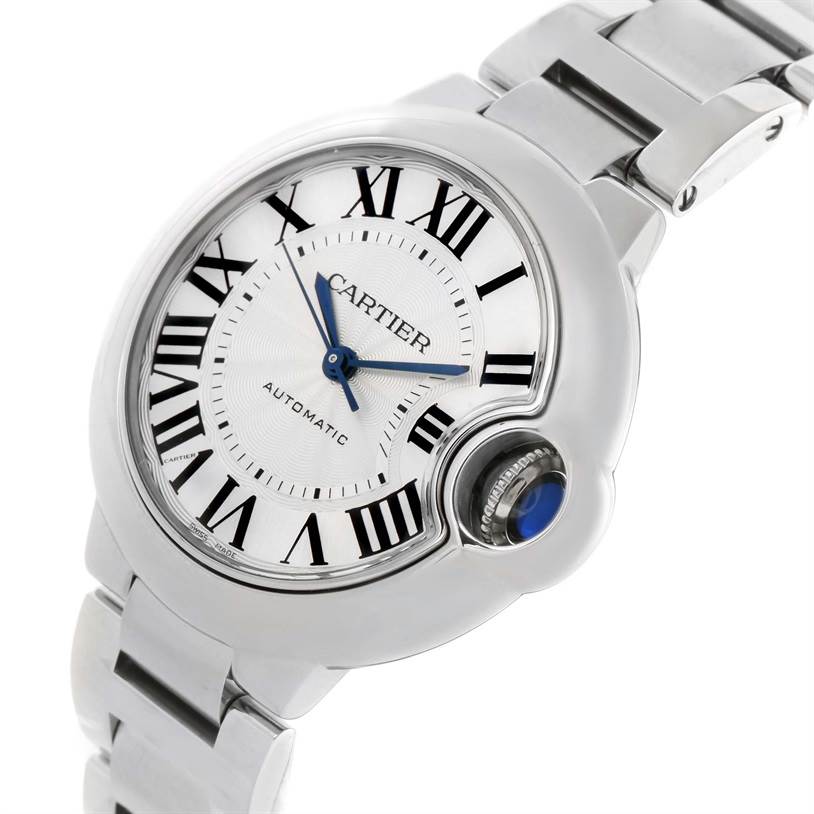 This image shows a close-up of the dial and crown of a Cartier Ballon Bleu W6920071 Women
s Stainless Steel Silver Dial W6920071 Women
s Stainless Steel Silver Dial watch from a slight side angle.
