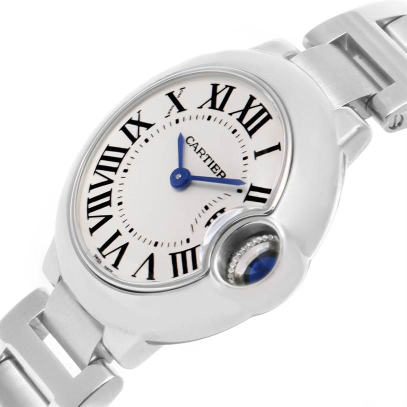 The image shows a close-up, angled view of the Cartier Ballon Bleu W69010Z4 Women
s Stainless Steel Silver Dial W69010Z4 Women
s Stainless Steel Silver Dial watch face and part of its stainless steel bracelet.