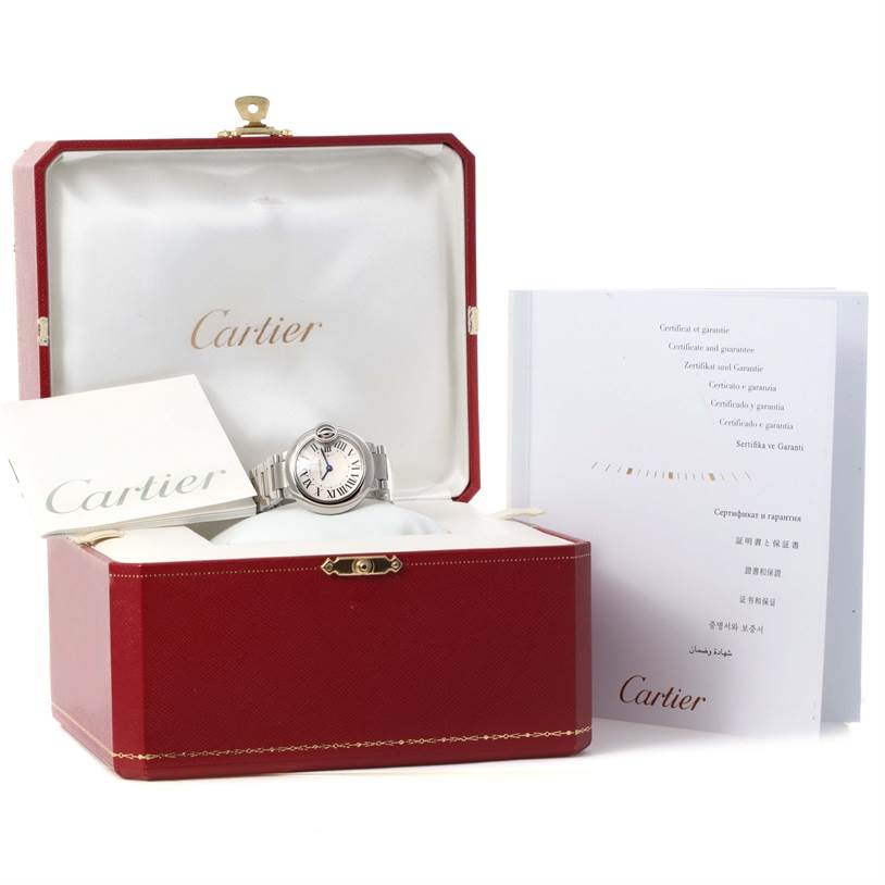 This image shows a Cartier Ballon Bleu W69010Z4 Women
s Stainless Steel Silver Dial W69010Z4 Women
s Stainless Steel Silver Dial watch in its open case, accompanied by booklets and a certificate.