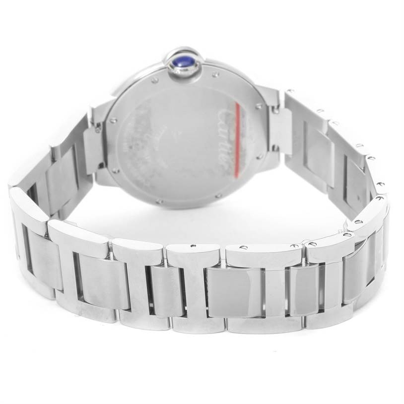 The image shows the back view of a Cartier Ballon Bleu W6920046 Women
s Stainless Steel Silver Dial W6920046 Women
s Stainless Steel Silver Dial watch, focusing on the case back and metal bracelet.