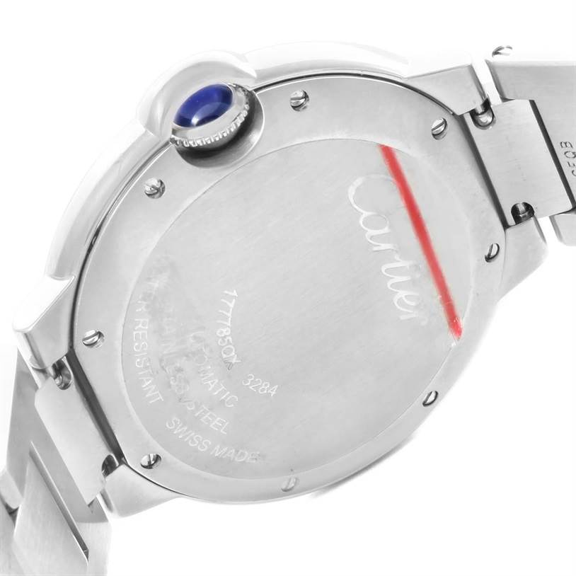 The image shows the back case and crown of the Ballon Bleu by Cartier watch.