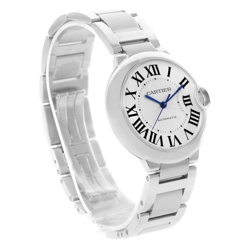 The image shows a side angle of the Cartier Ballon Bleu W6920046 Women
s Stainless Steel Silver Dial W6920046 Women
s Stainless Steel Silver Dial watch, highlighting its round case, dial, and metallic band.