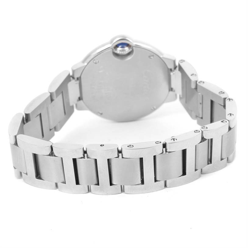 The image shows the back case and metal bracelet of the Ballon Bleu model by Cartier.