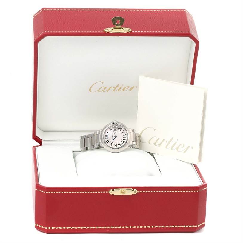 The image shows a Cartier Ballon Bleu W69010Z4 Women
s Stainless Steel Silver Dial W69010Z4 Women
s Stainless Steel Silver Dial watch positioned inside an open box along with a booklet.