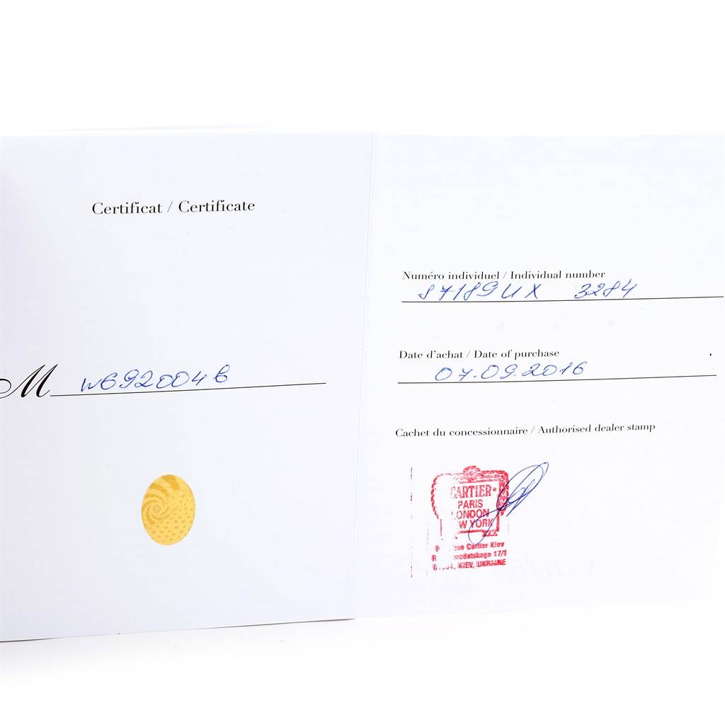 This image shows the warranty certificate for the Cartier Ballon Bleu W6920046 Women
s Stainless Steel Silver Dial W6920046 Women
s Stainless Steel Silver Dial model watch, including purchase details and dealer stamp.