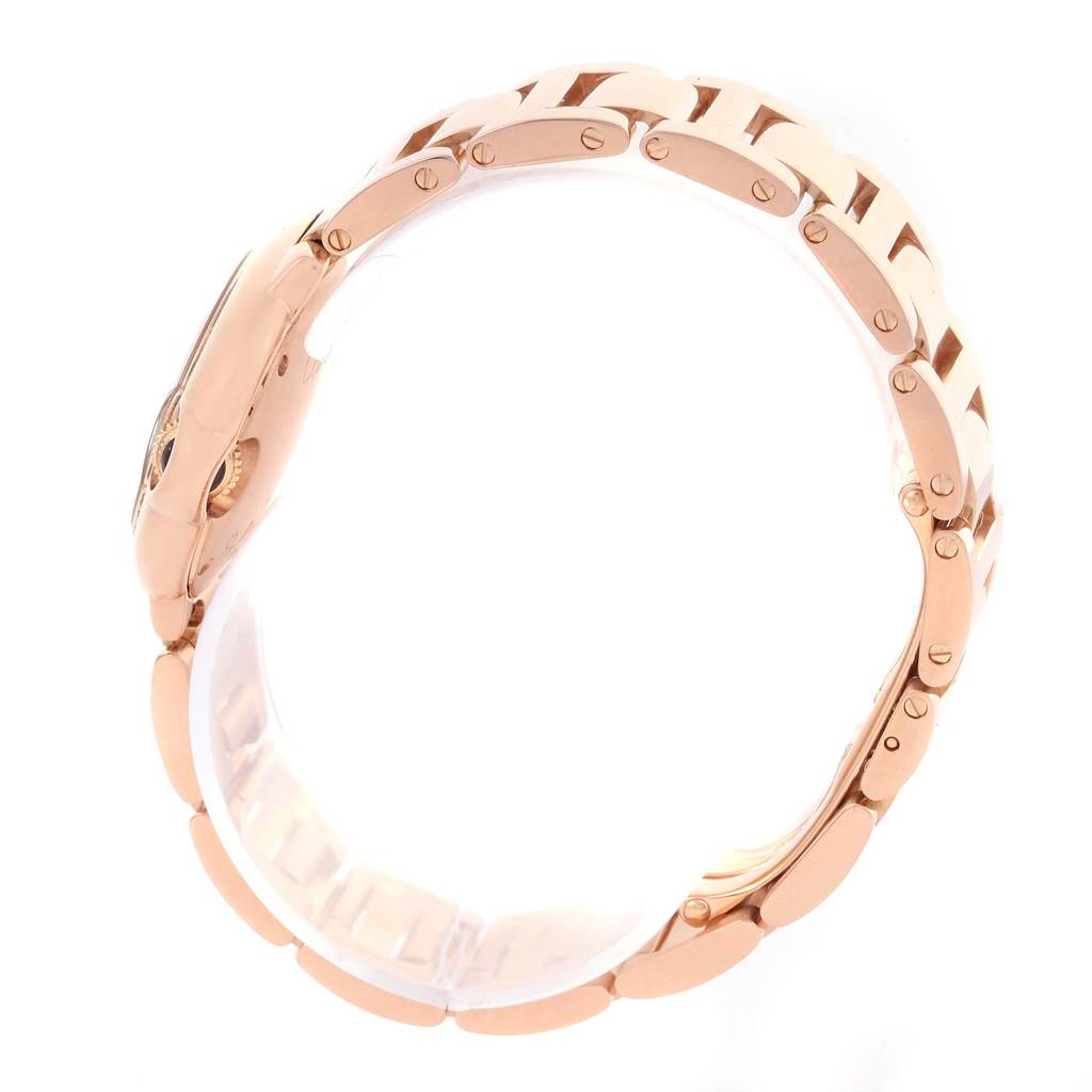 The image shows a side view of the rose gold bracelet and case of the Ballon Bleu model by Cartier.