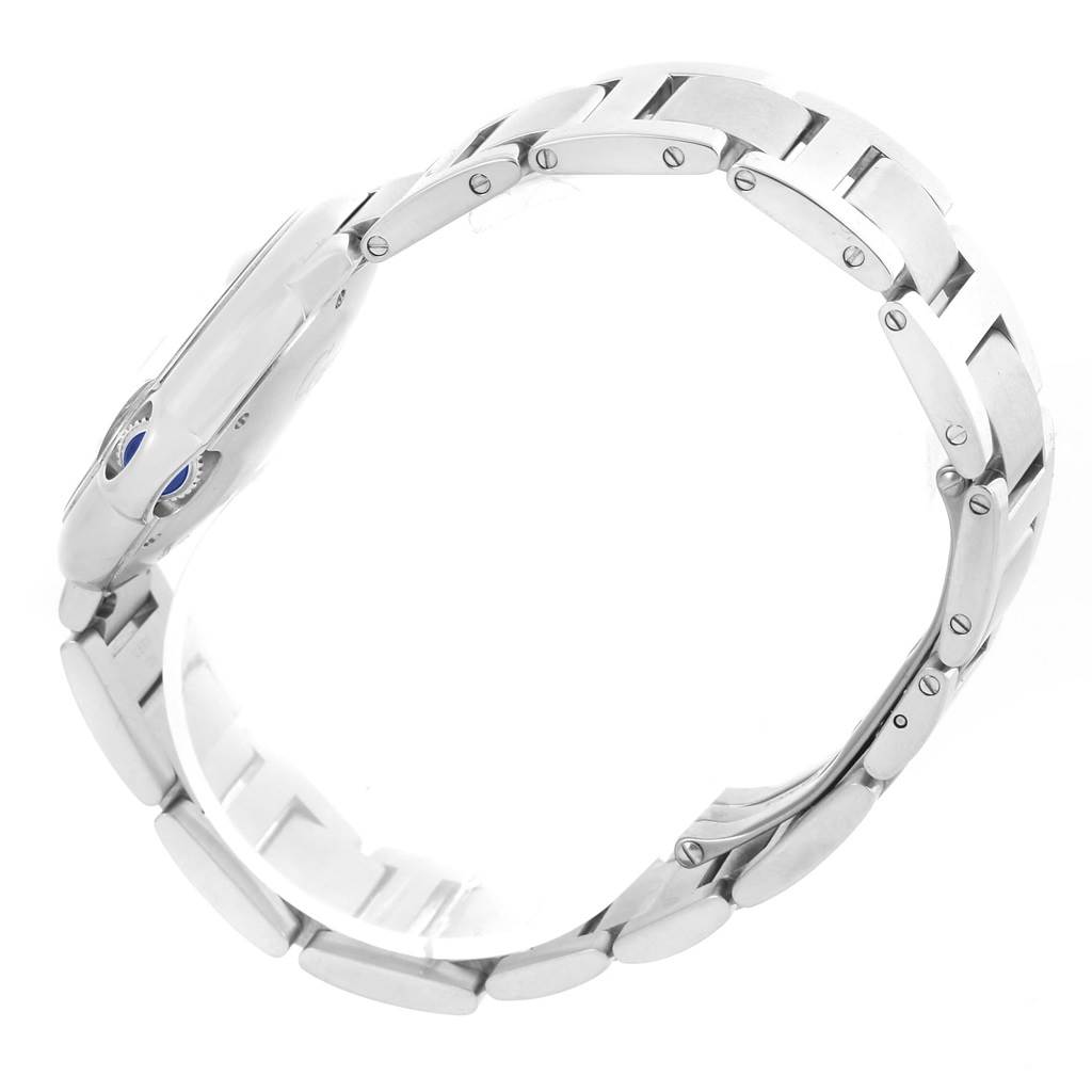 The image shows a side view of a Ballon Bleu de Cartier watch, focusing on the stainless steel bracelet and part of the case.