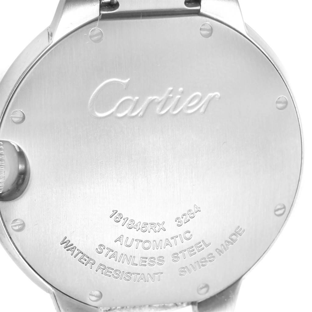 The image shows the back of the Cartier Ballon Bleu W6920046 Men
s Stainless Steel Silver Dial W6920046 Men
s Stainless Steel Silver Dial watch, highlighting the engraved details and stainless steel material.