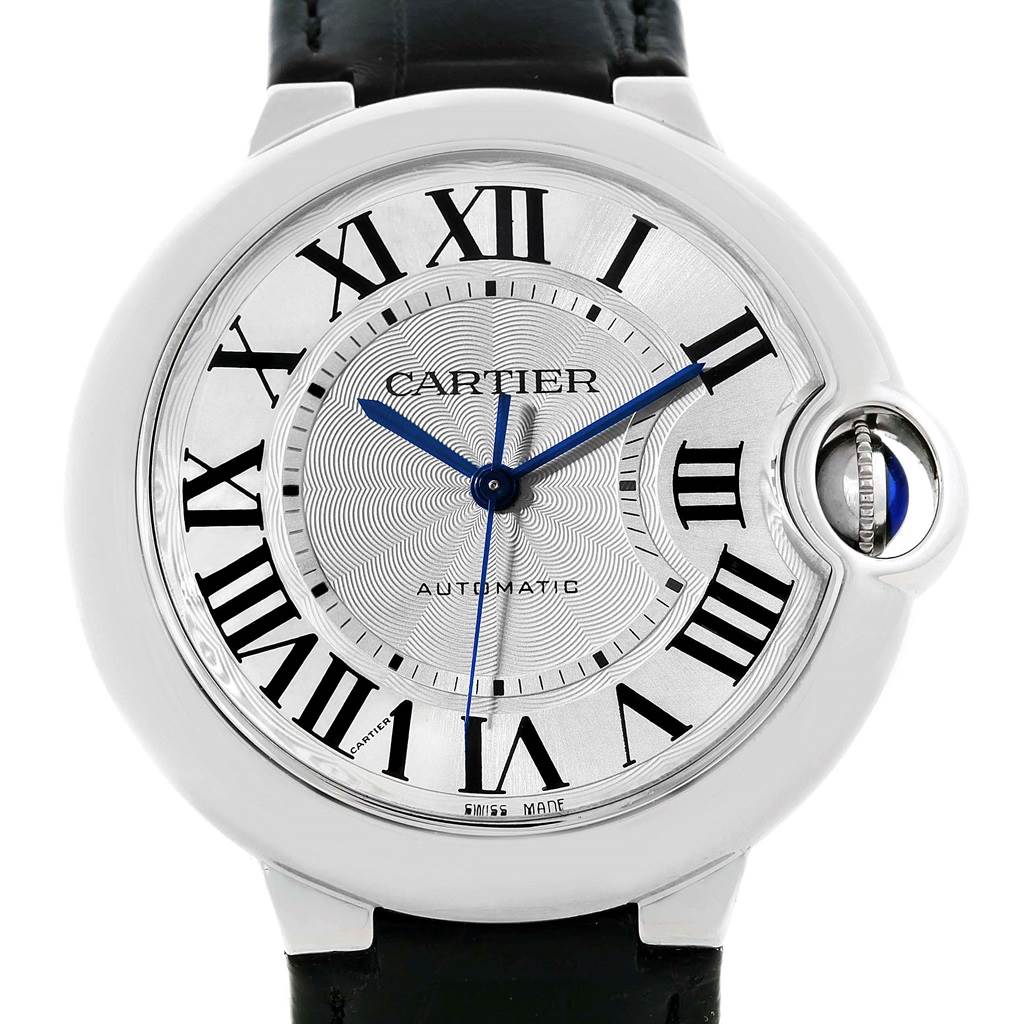 This image shows a close-up, front view of the dial and crown of a Ballon Bleu watch by Cartier.