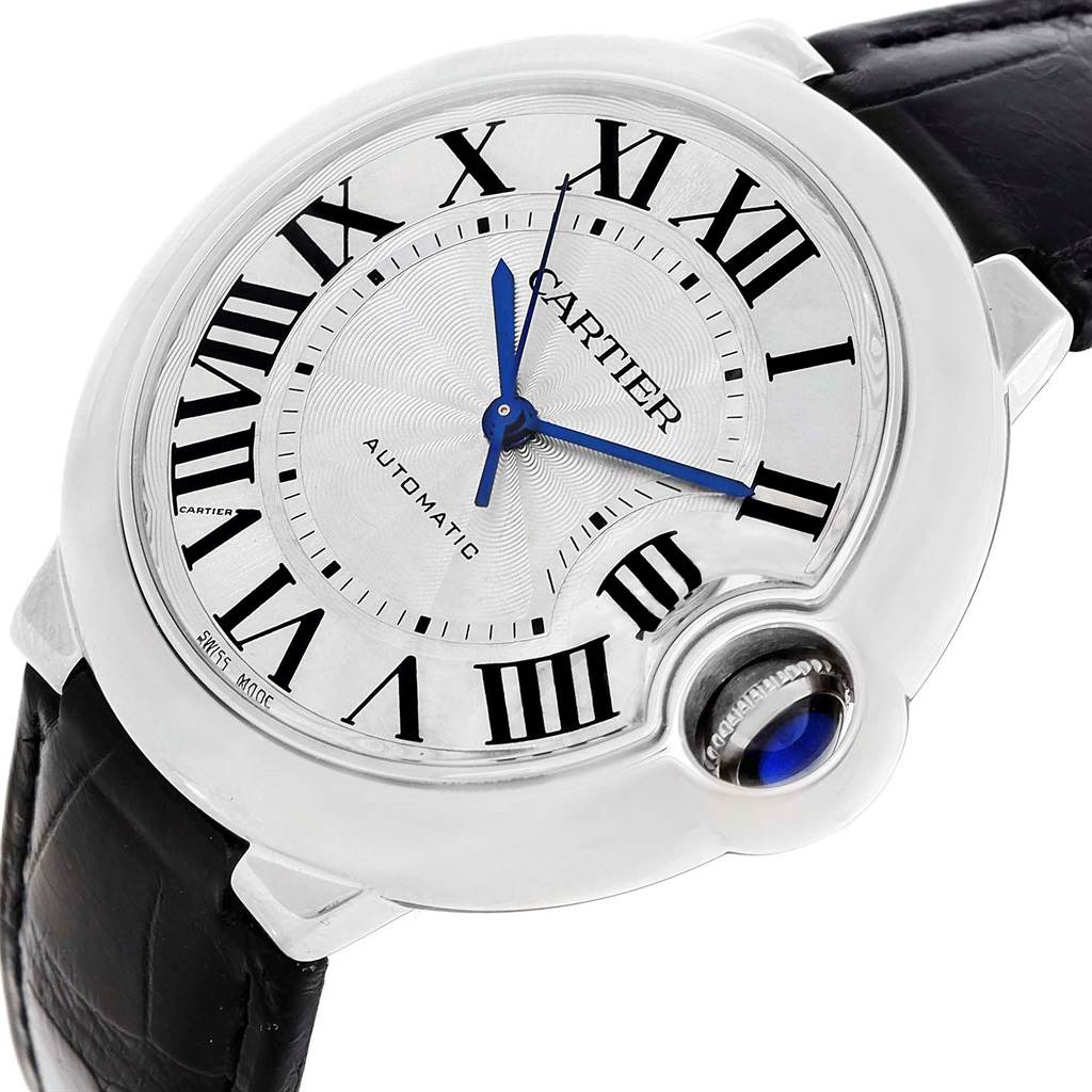 The image shows a close-up, angled view of a Cartier Ballon Bleu W69017Z4 Women
s Stainless Steel Silver Dial W69017Z4 Women
s Stainless Steel Silver Dial watch, highlighting its face, blue hands, and crown with sapphire.