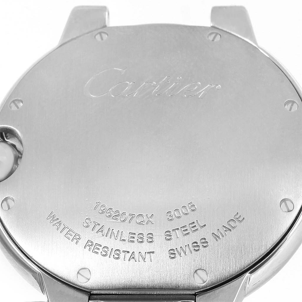 The image shows the back case of a Ballon Bleu model by Cartier, highlighting its engravings and material details.