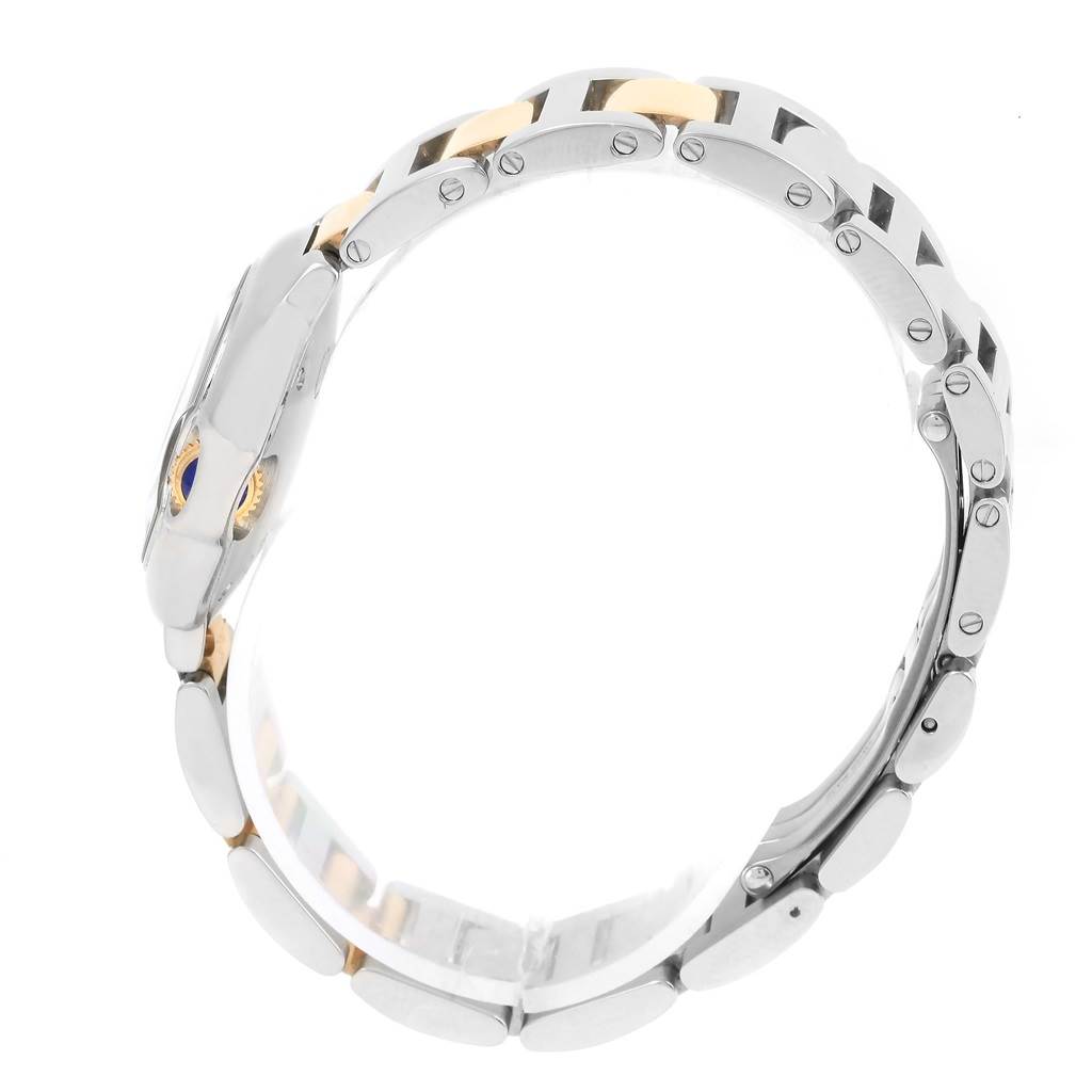 The image shows the side view of a Ballon Bleu by Cartier, focusing on its metal bracelet and side profile of the case.