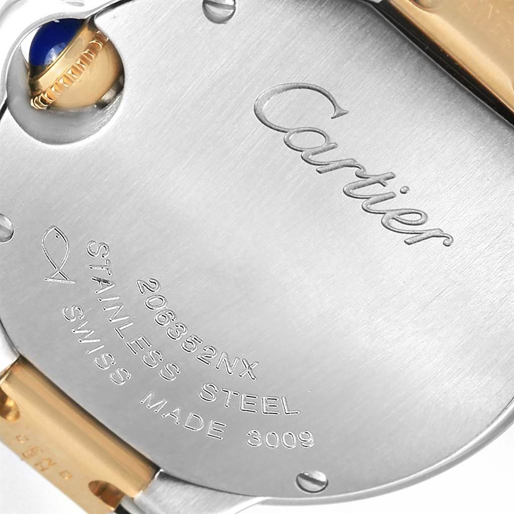 This image shows the back case of the Ballon Bleu model by Cartier, highlighting the engravings and part of the crown.