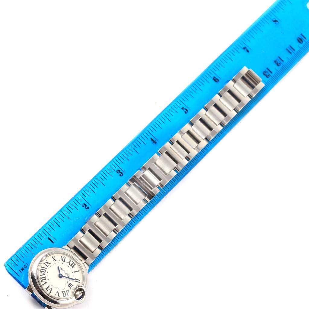 The image shows a horizontal angle of a Cartier Ballon Bleu W69010Z4 Women
s Stainless Steel Silver Dial W69010Z4 Women
s Stainless Steel Silver Dial watch with its stainless steel bracelet measured against a ruler.