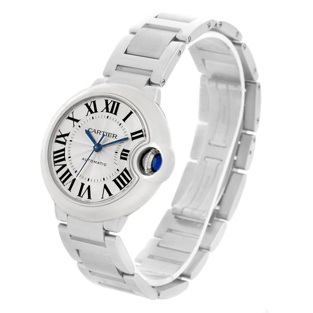 The image shows a side view of the Cartier Ballon Bleu W6920046 Women
s Stainless Steel Silver Dial W6920046 Women
s Stainless Steel Silver Dial watch prominently displaying the face, Roman numerals, and part of the metal bracelet.